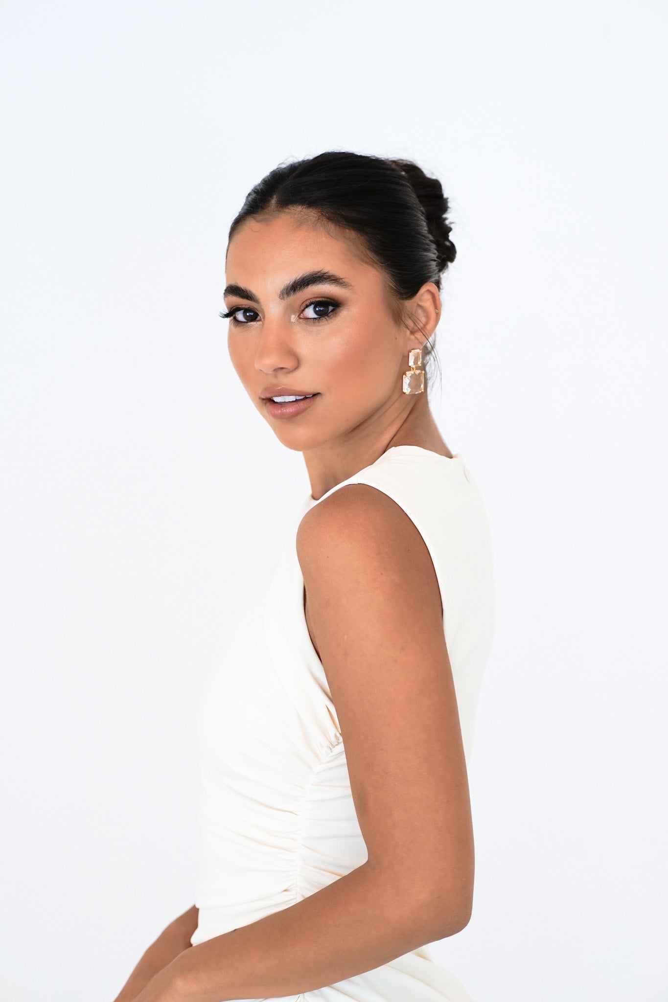 Close-up of bride looking into camera – Bianca Earrings highlighted with elegant focus