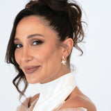 Bride wearing Loretta Earrings – updo hairstyle, bridal gloves, soft smile and direct gaze into camera