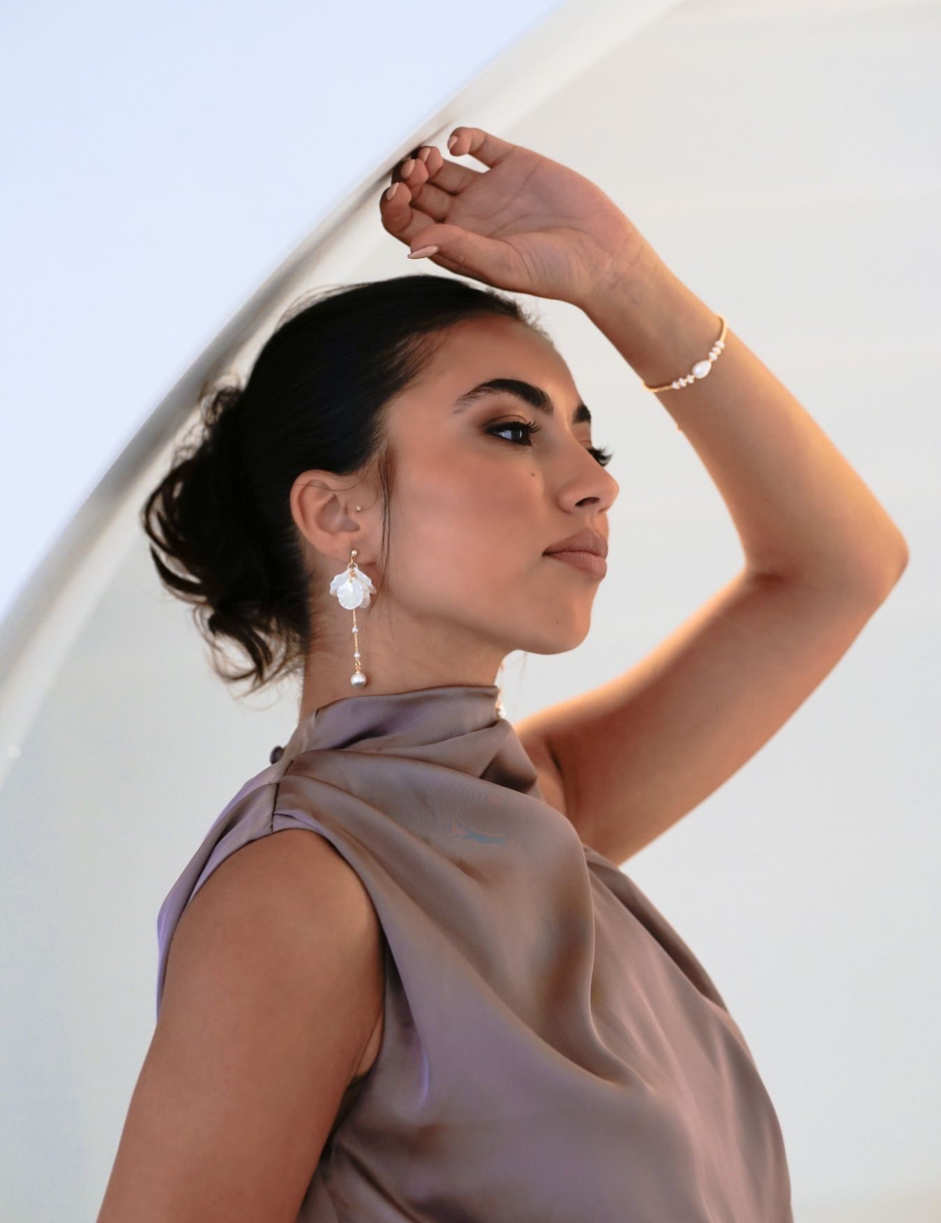 Bridesmaid in purple dress wearing the Anika Earrings