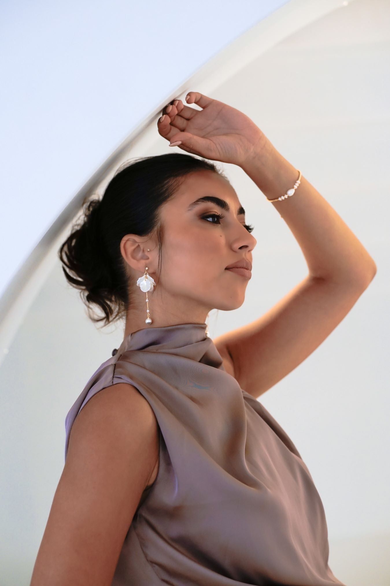 Bridesmaid in purple dress wearing the Anika Earrings