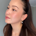 Woman smiling wearing Savannah Earrings in gold