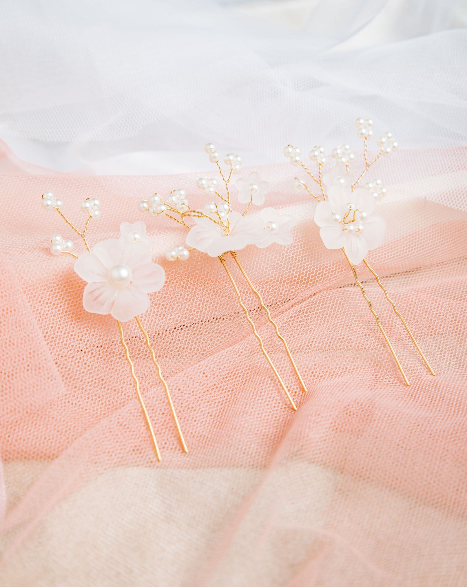 Beth Hair Pins on mesh and pink lace setting – layered textures with a romantic, ethereal tone