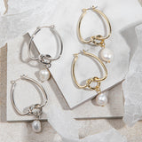 Celeste Earrings – gold/silver knot and pearl drop earrings on white tile background
