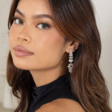 Woman wearing Jessica Earrings in silver – hair down, showcasing full length and sparkle