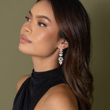 Woman in black halter dress wearing Jessica Earrings – side profile showing full earring drop