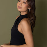 Woman in black halter dress wearing Jessica Earrings – side profile showing full earring drop