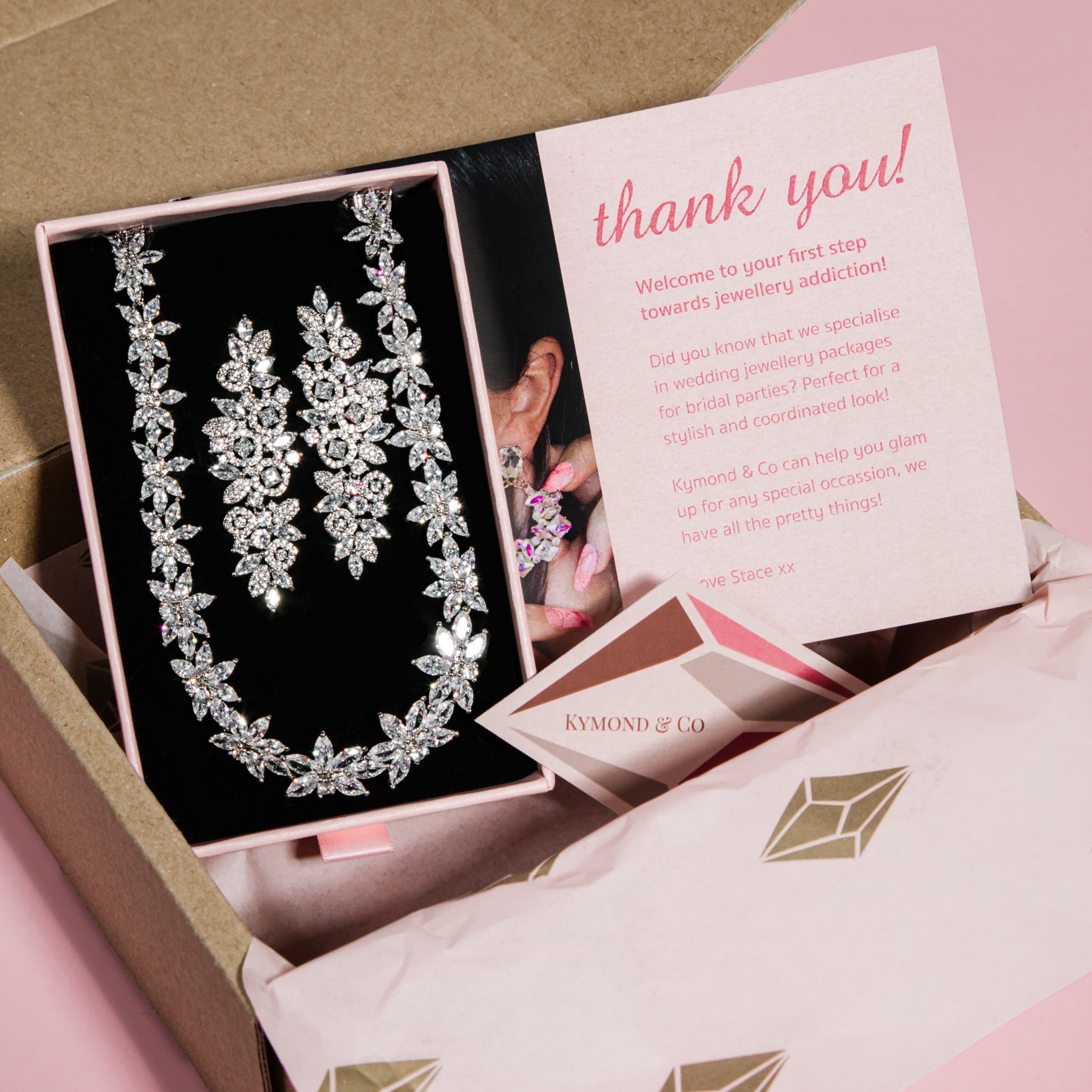 The Polly Set – matching floral cubic zirconia necklace and earrings displayed in gift packaging
