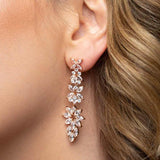 Jessica Earrings in rose gold – close-up of floral chandelier earring from lobe to jawline