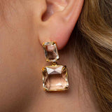 Close-up of bride’s ear with gold Bianca Earring – pearl glimmer against swept-back dark blonde hair