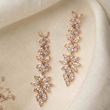 Jessica Earrings – rose gold floral chandelier earrings on fabric with soft lighting