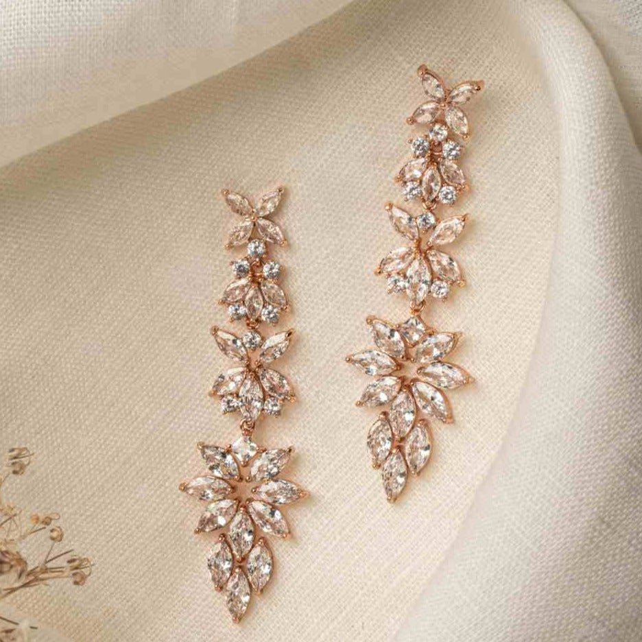 Jessica Earrings – rose gold floral chandelier earrings on fabric with soft lighting