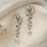 Marlo Earrings – vintage-style crystal drop earrings on off-white linen with dried flower detail