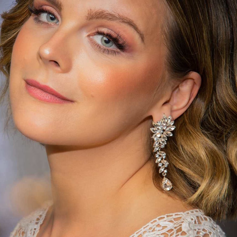 Bride wearing Marlo Earrings – blonde hair, lace gown, glowing makeup, looking into camera