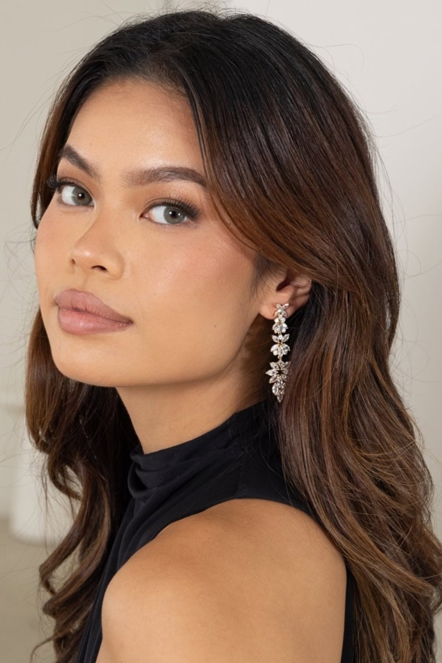 Woman wearing Jessica Earrings in silver – hair down, showcasing full length and sparkle