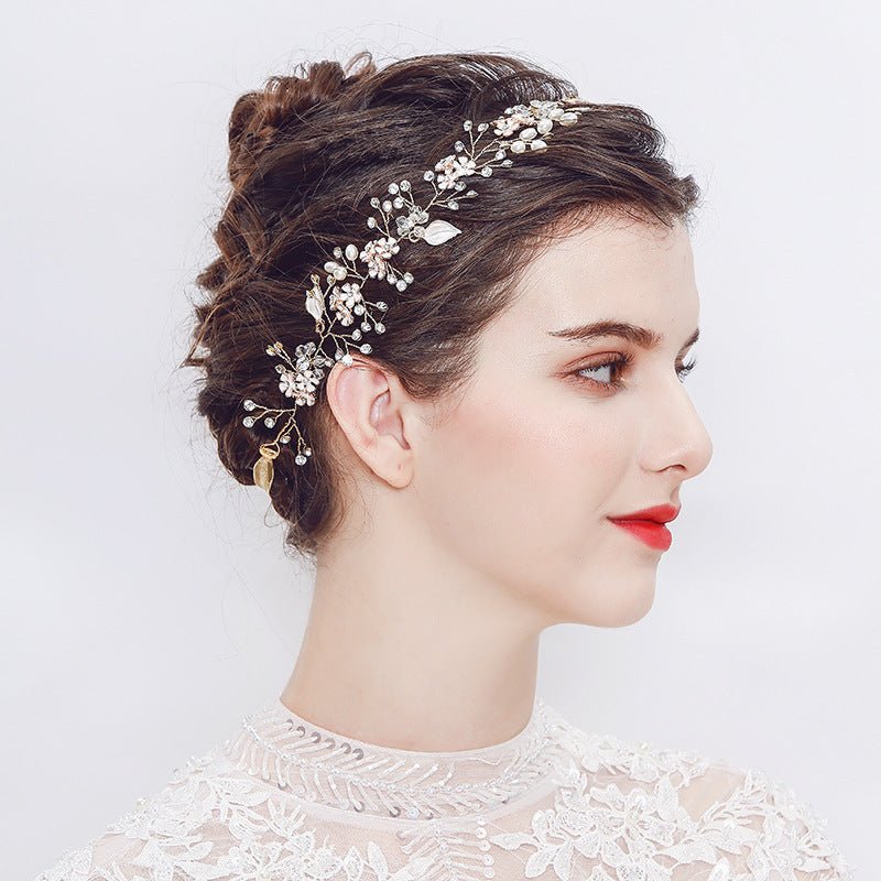 Bride wearing Nova Hairpiece with hair up, red lipstick, and long-sleeve floral lace gown – elegant bridal headshot