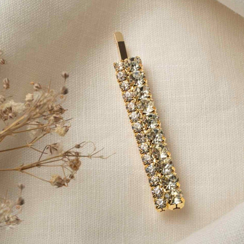 old Hailey Hair Pin – large double row rhinestone pin on linen cloth beside dried flower